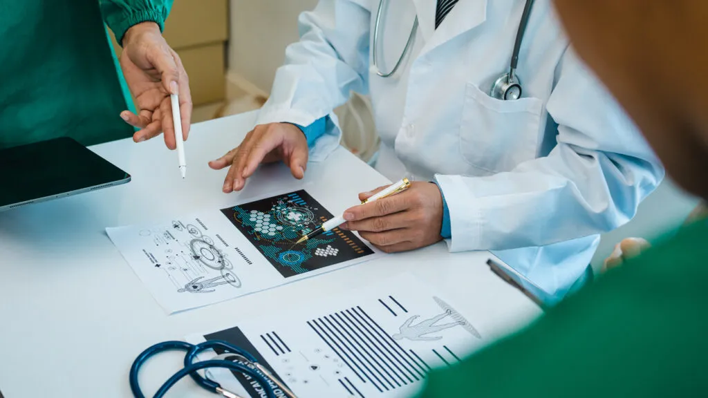Medical professionals reviewing information together