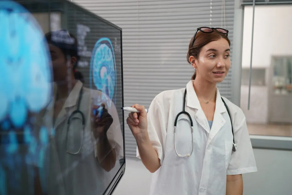 Doctor reviewing medical imaging with a colleague