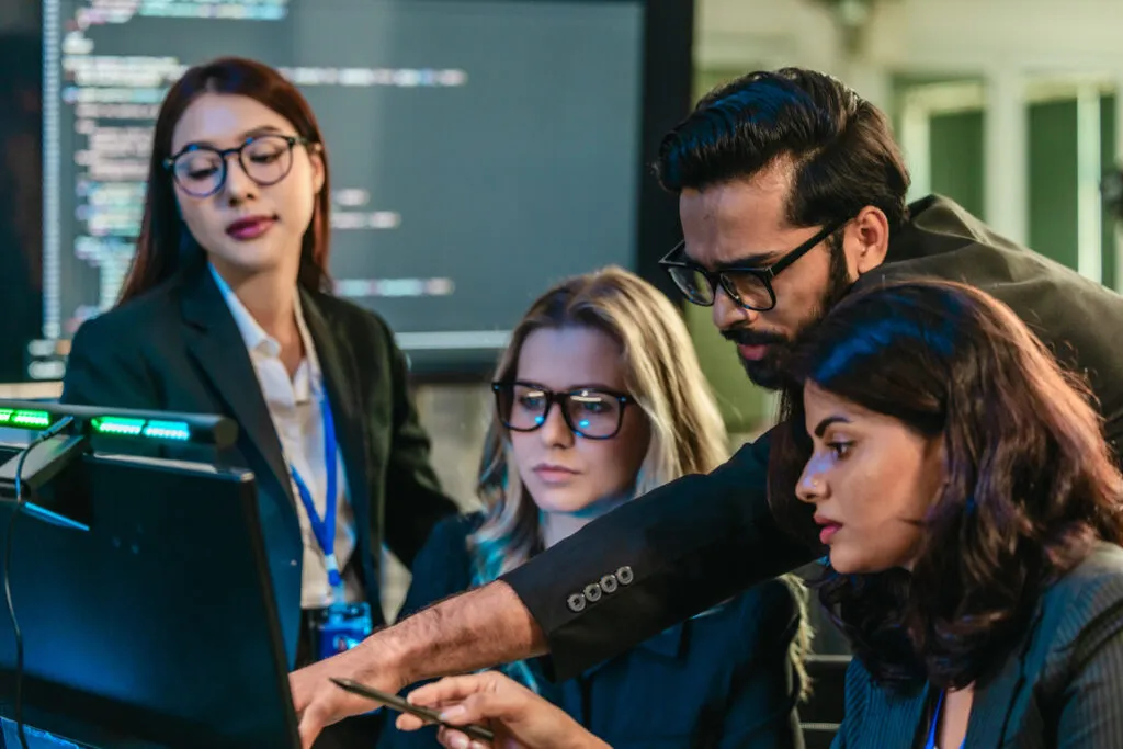 Senior technology professionals coaching colleagues