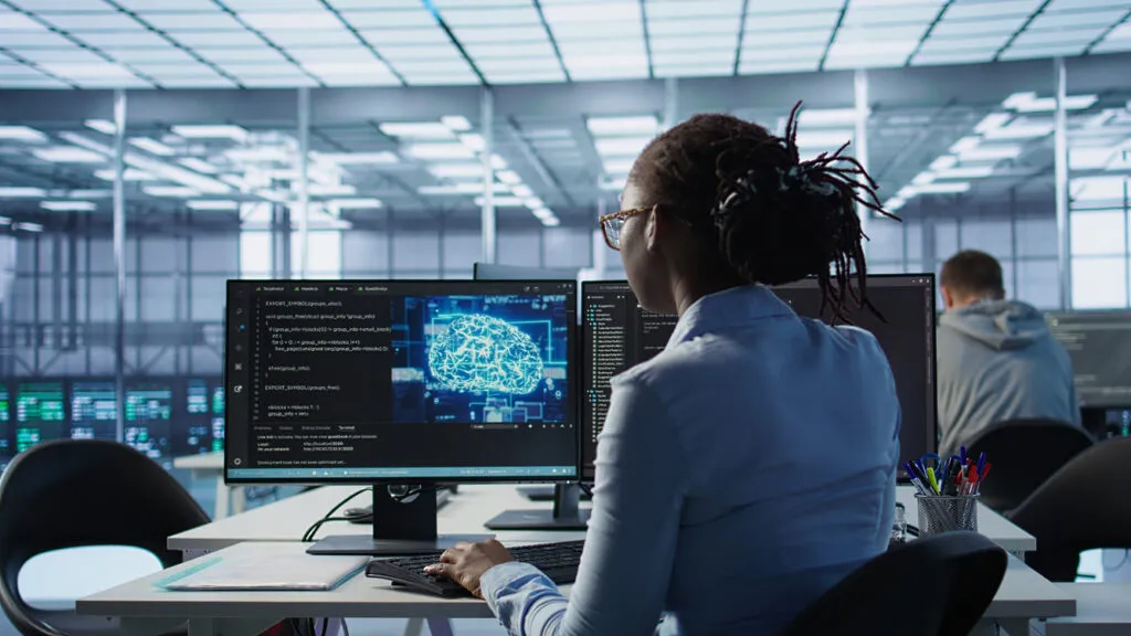 Technician monitoring an AI-enabled server room